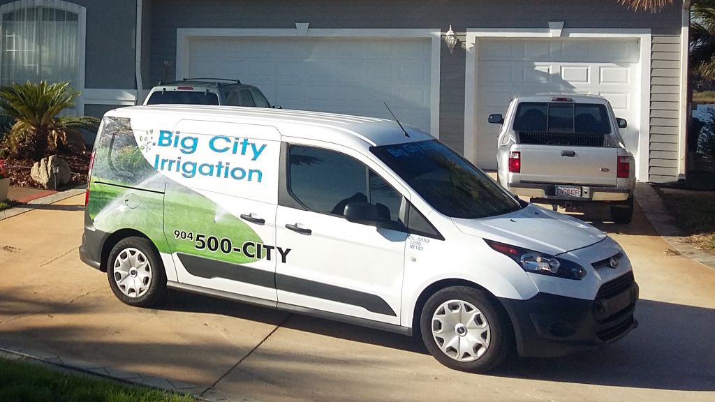 Big City Irrigation truck in front of a house